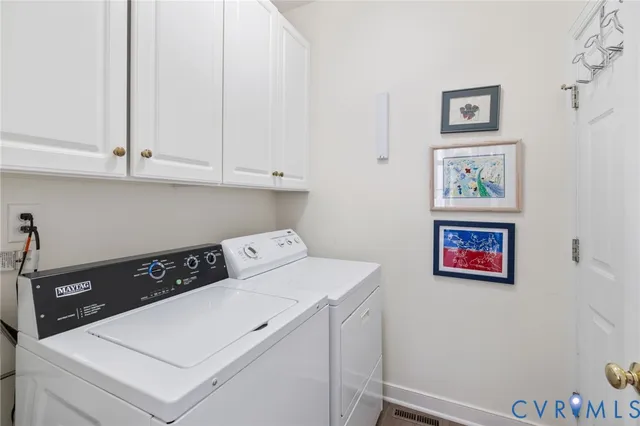 a view of kitchen with cabinet and wall