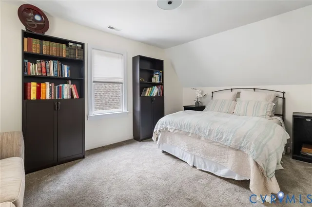 a bedroom with a bed and closet