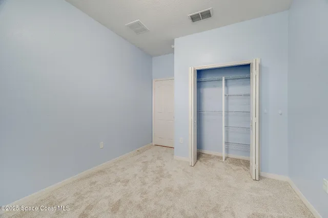 a living room with a bed and a table