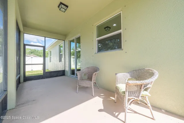 a front view of house with a garden
