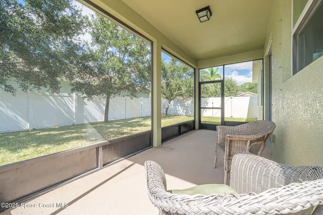 front view of a house with swimming pool and a yard