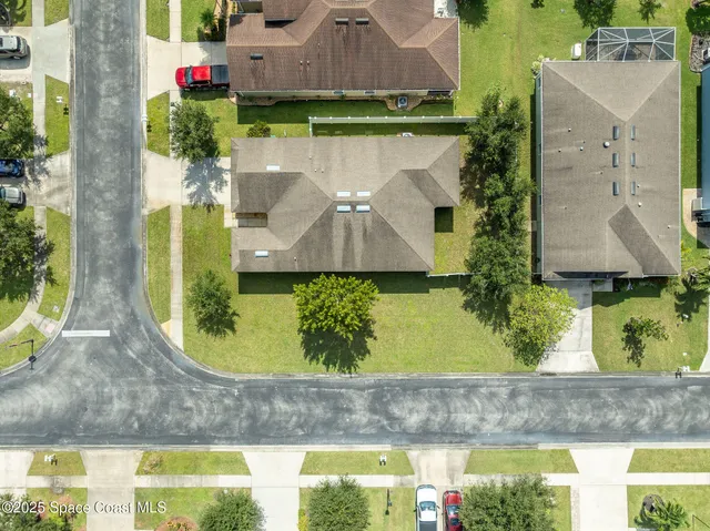 a view of a patio with dining table and chairs with wooden floor