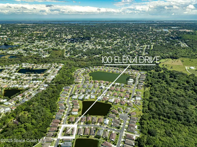 a view of a swimming pool with outdoor seating