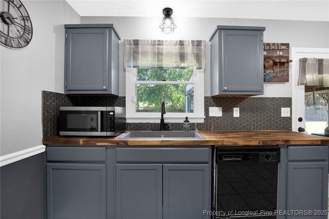 156 Barefoot Road Fayetteville, NC 28306 - Photo 13 of 28 a kitchen with a sink and a window