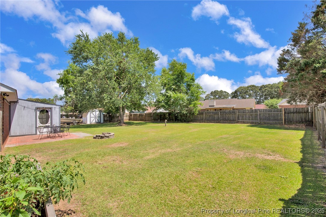 156 Barefoot Road Fayetteville, NC 28306 - Photo 24 of 28 a view of swimming pool with an outdoor space and seating area