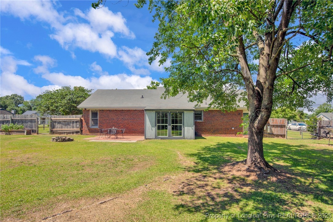 156 Barefoot Road Fayetteville, NC 28306 - Photo 26 of 28 a view of a house with pool and a yard