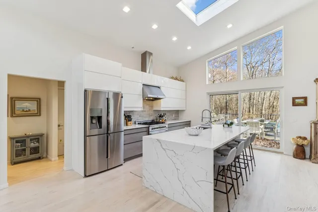 a kitchen with refrigerator cabinets and furniture