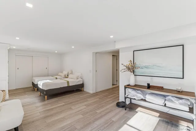 a living room with hard wood flooring and furniture