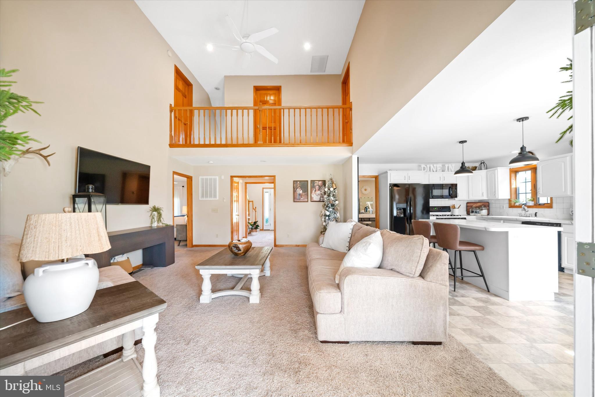1265 Bowman Road Milford, DE 19963 - Photo 12 of 60 a living room with furniture and a flat screen tv