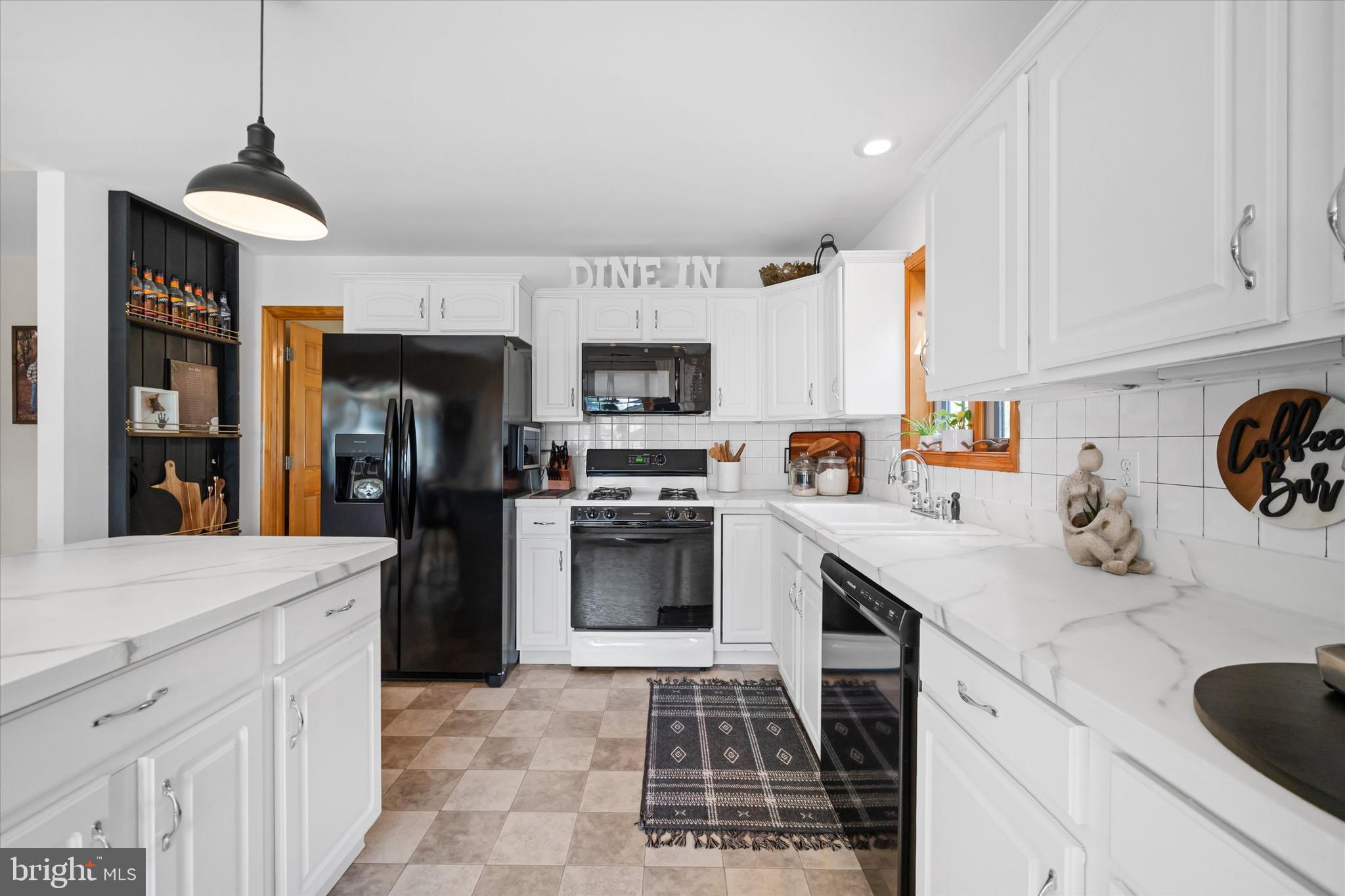 1265 Bowman Road Milford, DE 19963 - Photo 15 of 60 a kitchen with stainless steel appliances granite countertop a refrigerator and a stove top oven