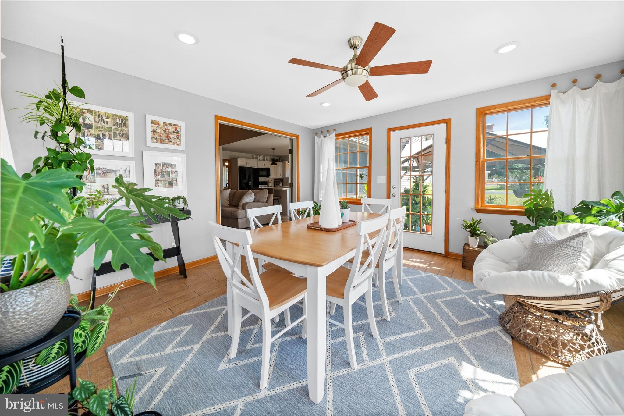 1265 Bowman Road Milford, DE 19963 - Photo 22 of 60 a dining room with furniture a window and a potted plant