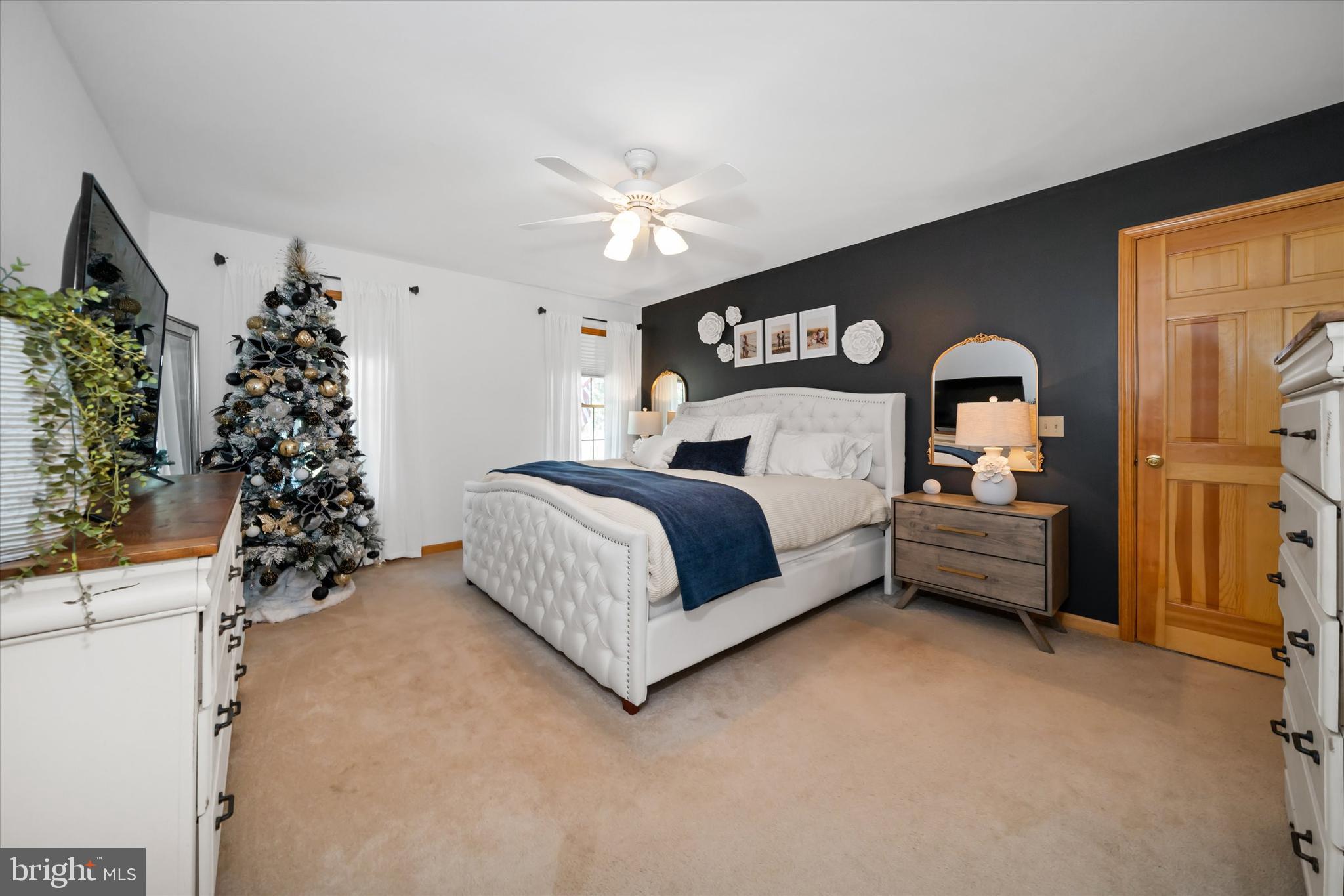 1265 Bowman Road Milford, DE 19963 - Photo 24 of 60 a bedroom with a bed and a chandelier