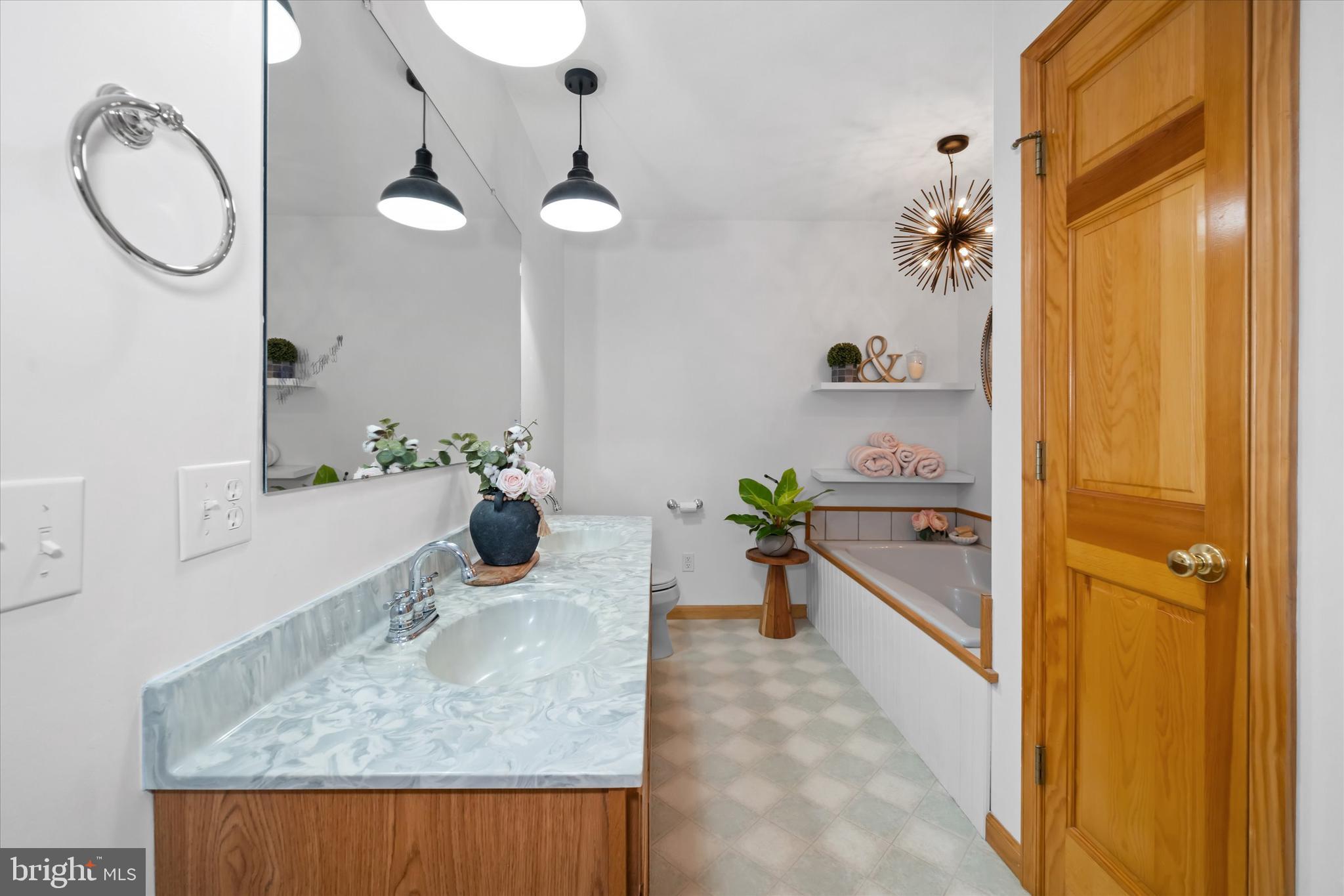1265 Bowman Road Milford, DE 19963 - Photo 28 of 60 a dining hall with a sink and chandelier
