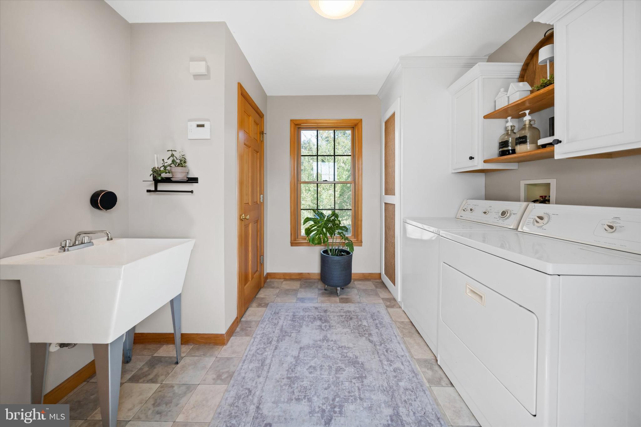 1265 Bowman Road Milford, DE 19963 - Photo 35 of 60 a view of a room that has a couch and a table in it