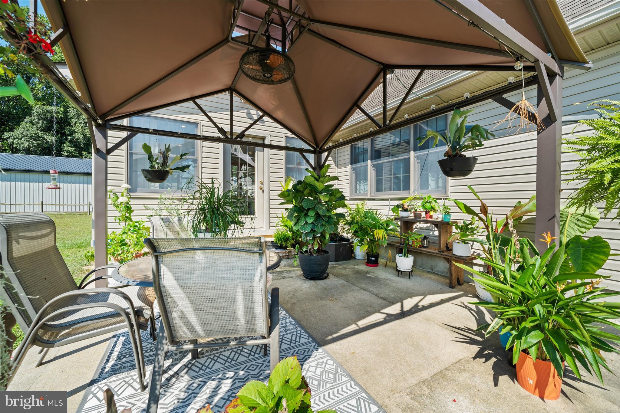 1265 Bowman Road Milford, DE 19963 - Photo 4 of 60 a view of a chairs and table in a patio
