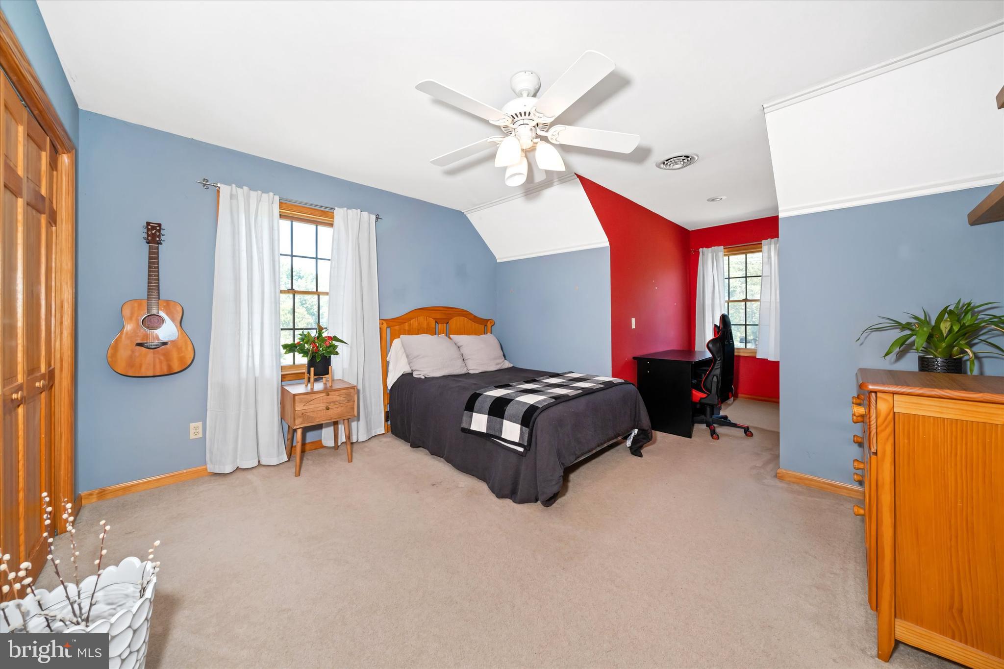 1265 Bowman Road Milford, DE 19963 - Photo 41 of 60 a living room with furniture a chandelier and a window