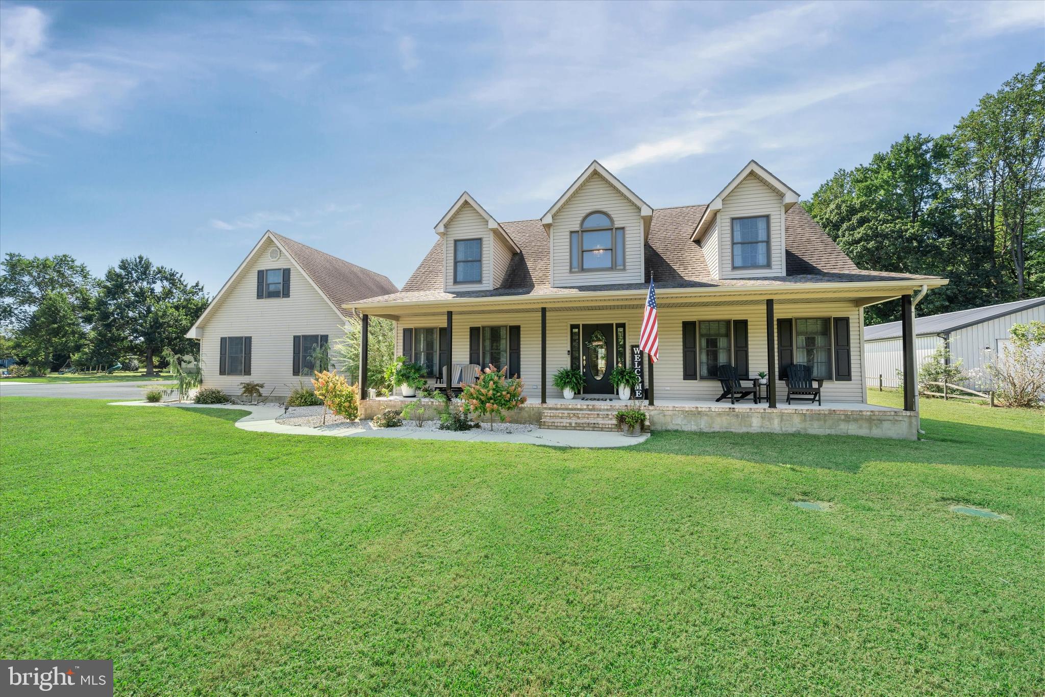 1265 Bowman Road Milford, DE 19963 - Photo 45 of 60 a front view of a house with yard patio and green space
