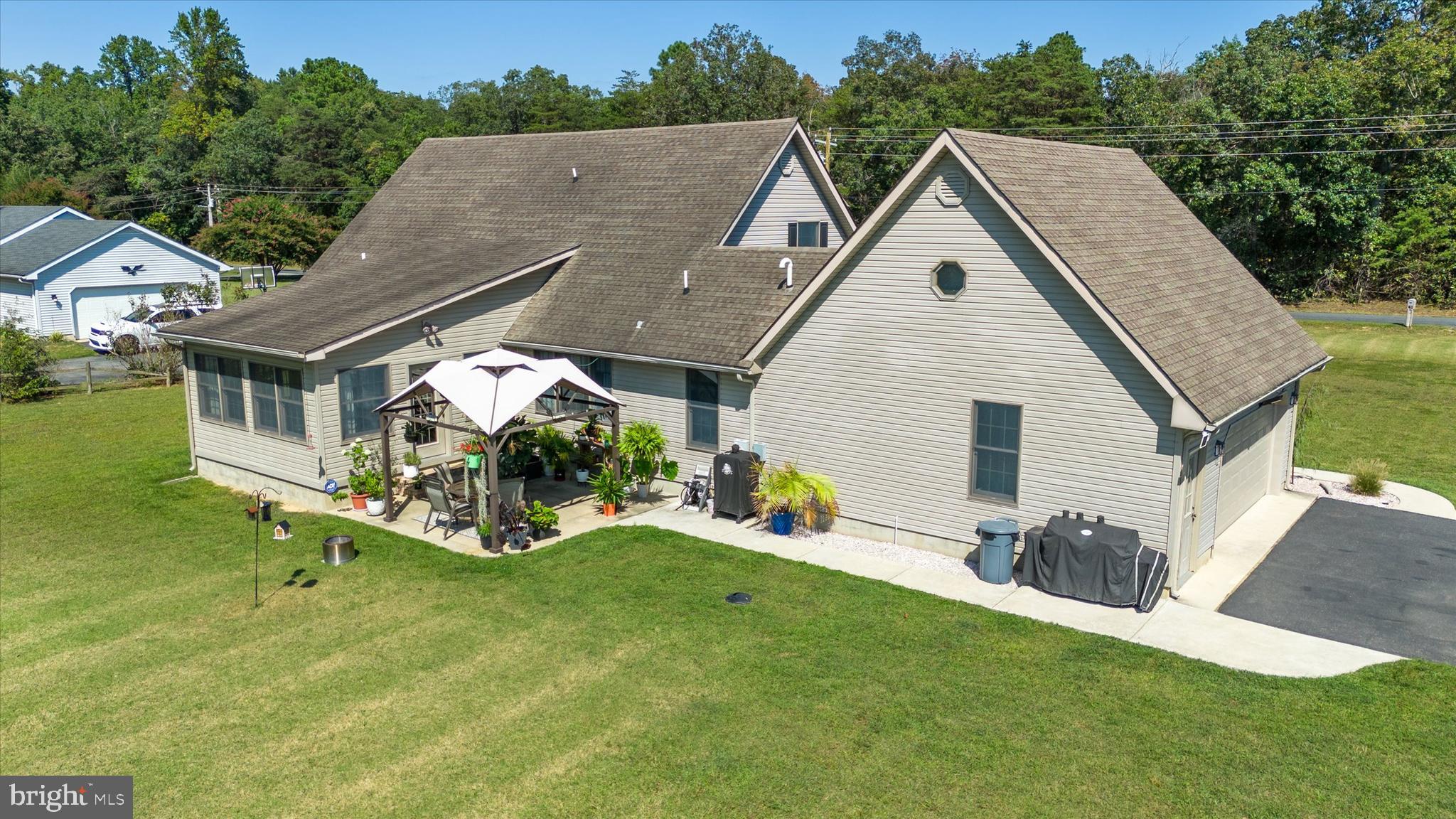 1265 Bowman Road Milford, DE 19963 - Photo 50 of 60 a view of a house with a yard and sitting area