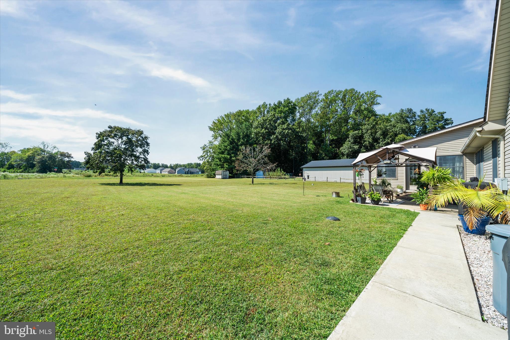 1265 Bowman Road Milford, DE 19963 - Photo 54 of 60 a front view of a house with garden