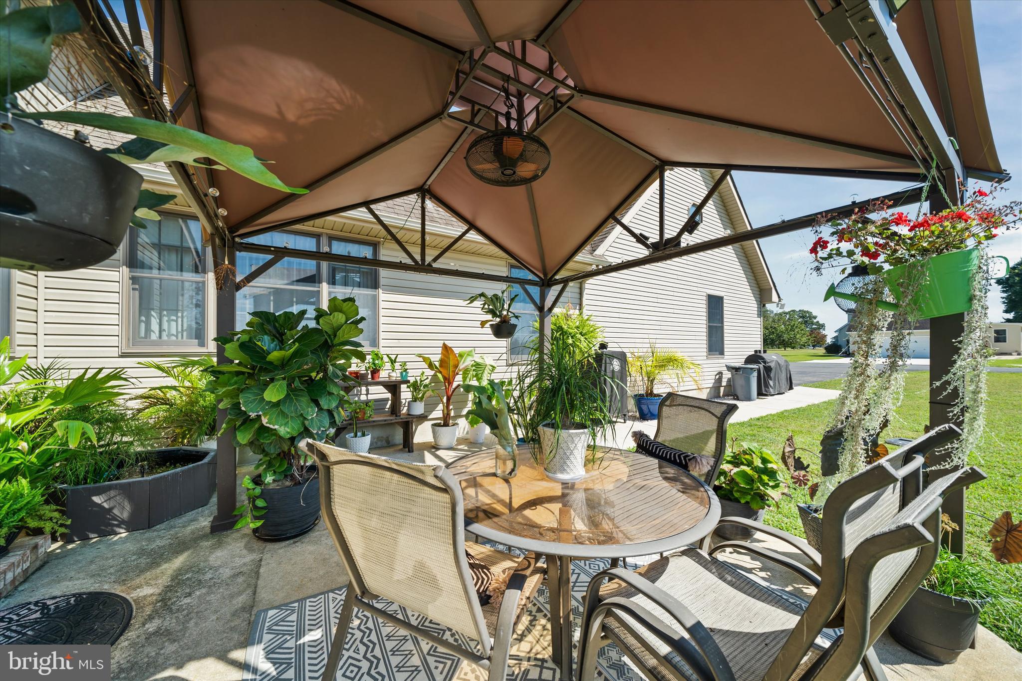 1265 Bowman Road Milford, DE 19963 - Photo 55 of 60 a backyard of a house with table and chairs