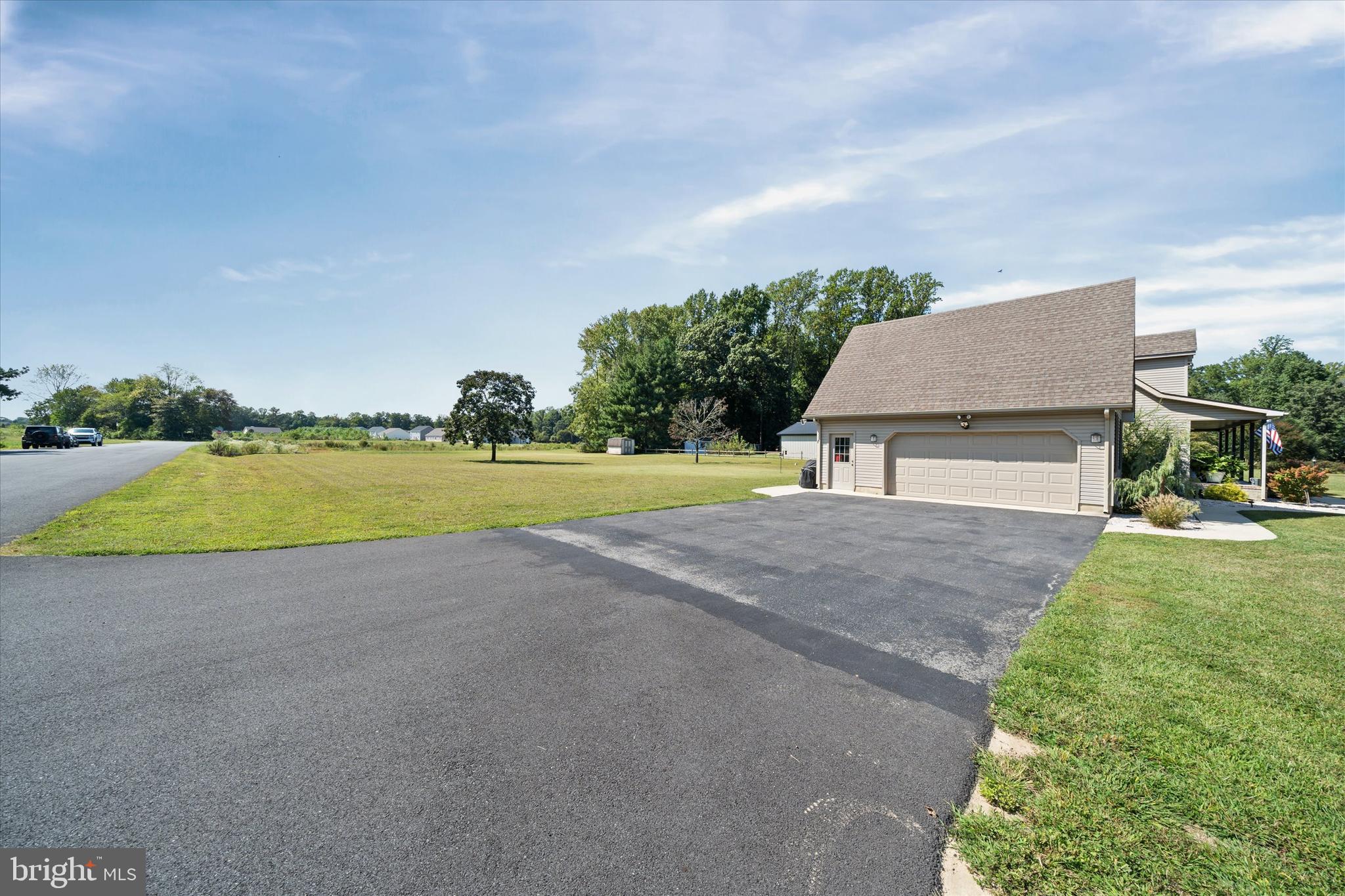 1265 Bowman Road Milford, DE 19963 - Photo 60 of 60 a view of a house with pool and a yard