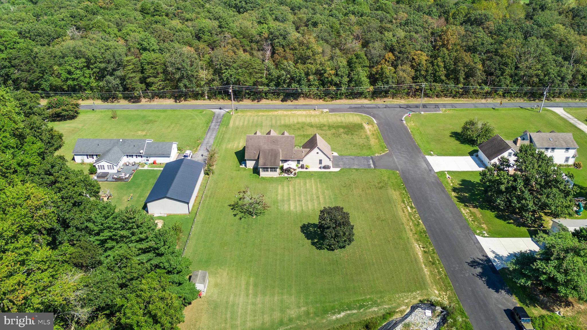1265 Bowman Road Milford, DE 19963 - Photo 7 of 60 a view of a swimming pool with a patio