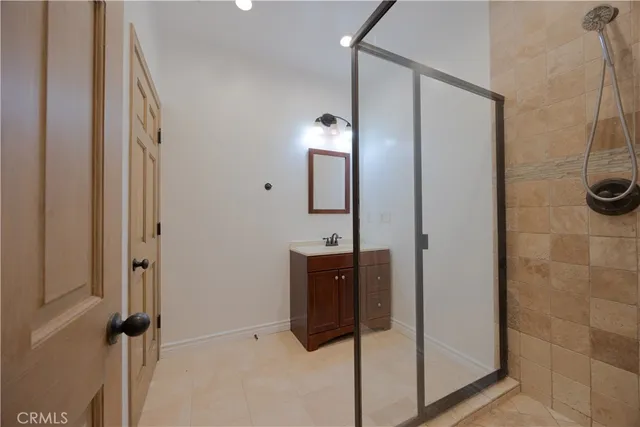 a bathroom with a shower and a sink