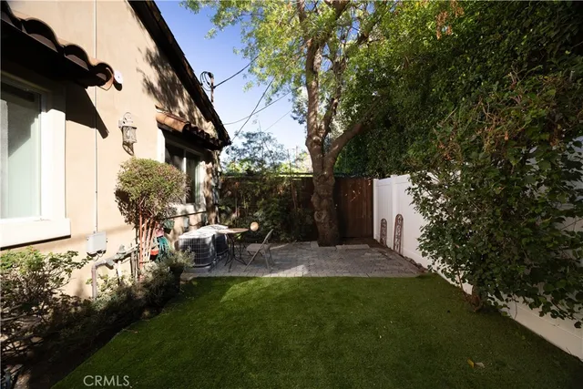 a view of yard with patio