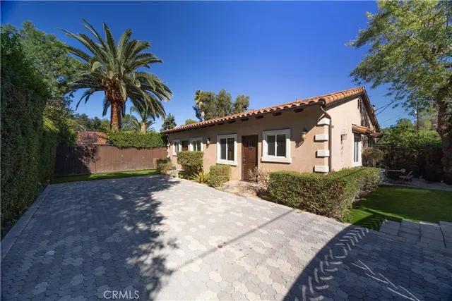 a house with a tree in front of it