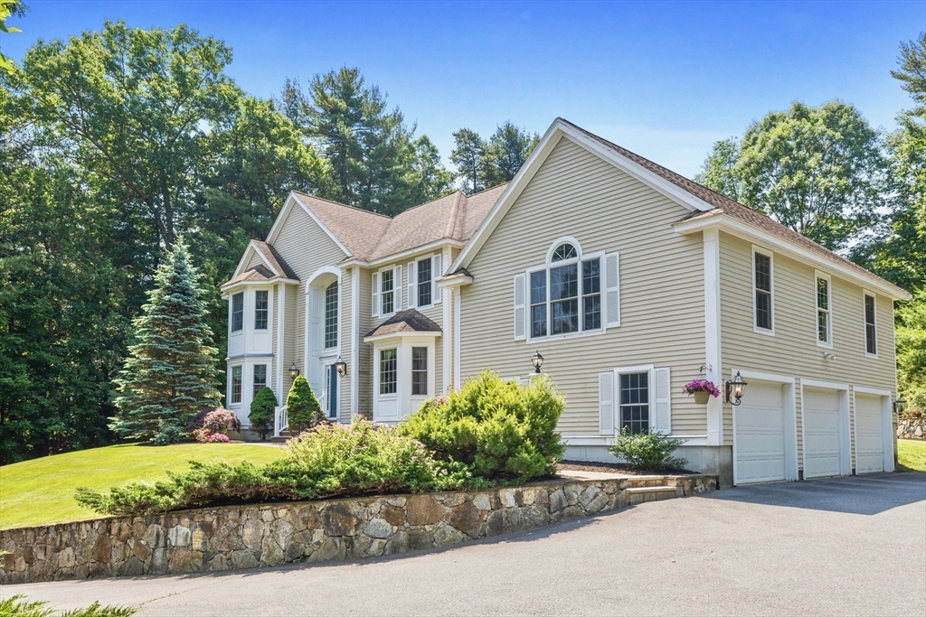 52 Chandler Circle Andover, MA 01810 - Photo 22 of 25 a front view of a house with a yard