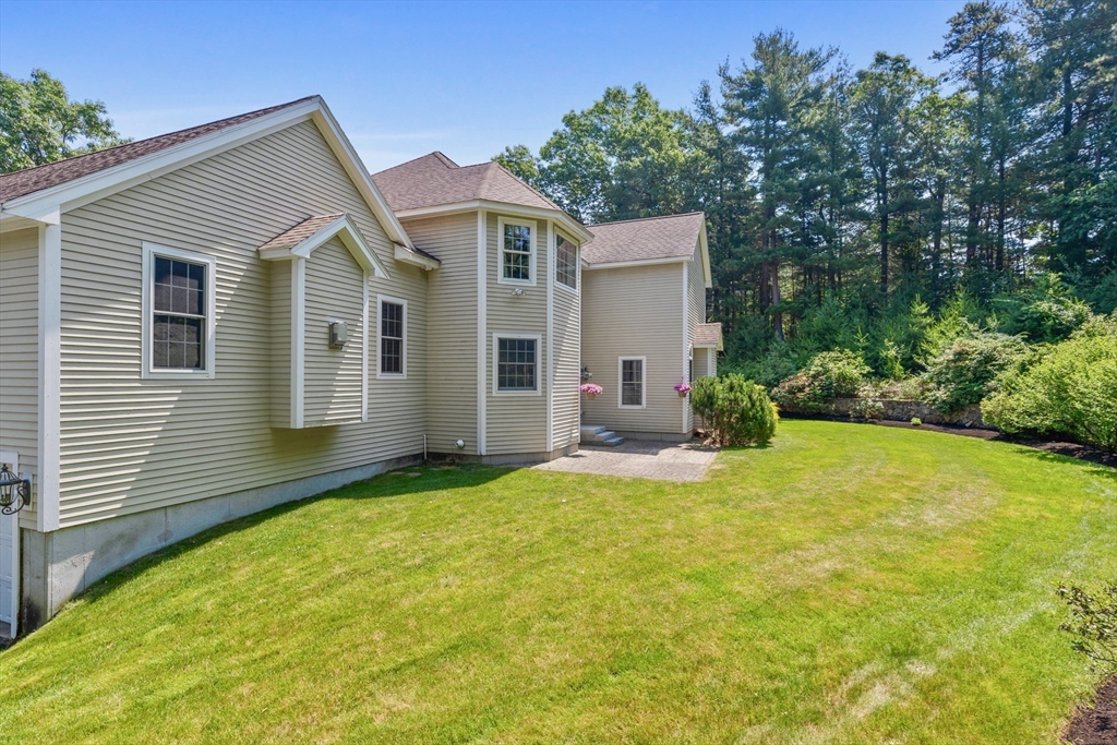 52 Chandler Circle Andover, MA 01810 - Photo 23 of 25 a view of a house with backyard and garden