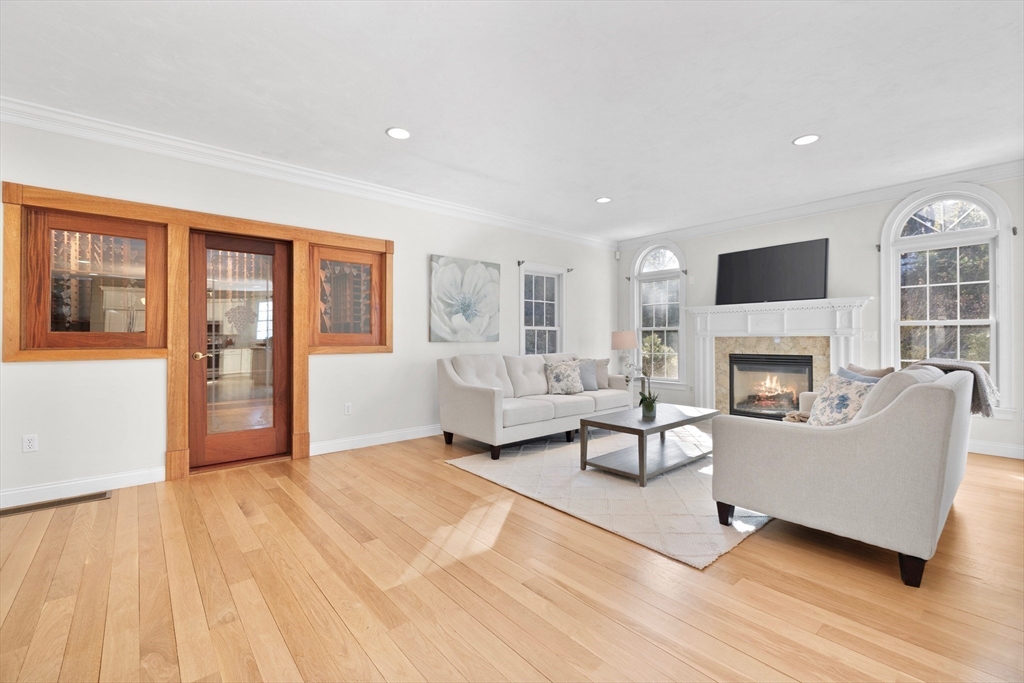 52 Chandler Circle Andover, MA 01810 - Photo 3 of 25 a living room with furniture and a fireplace