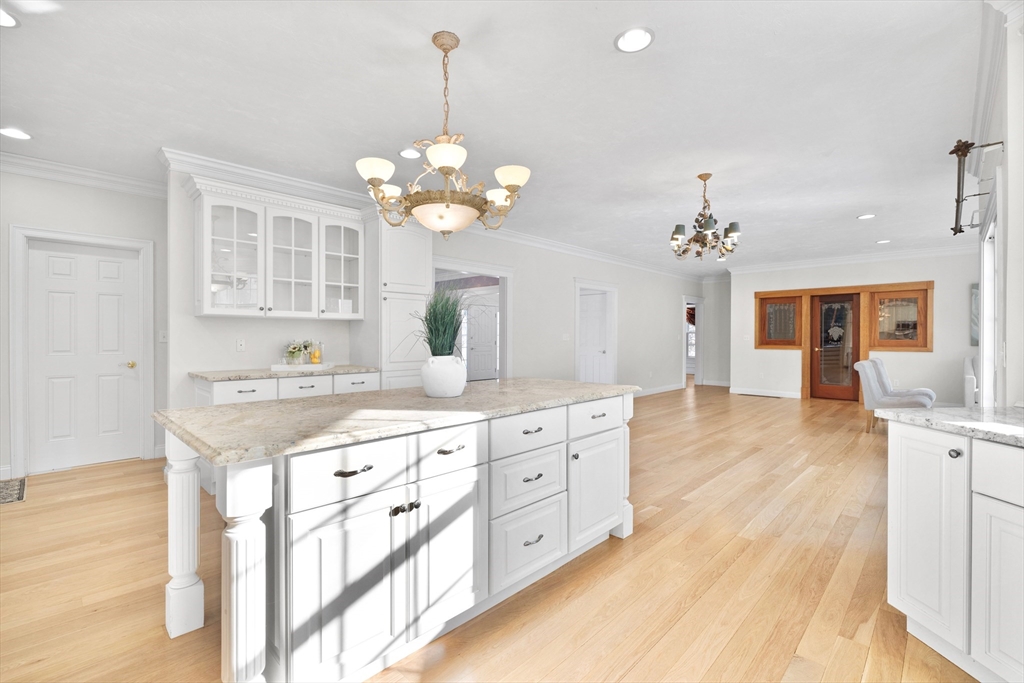 52 Chandler Circle Andover, MA 01810 - Photo 5 of 25 a view of a kitchen center island cabinets and wooden floor