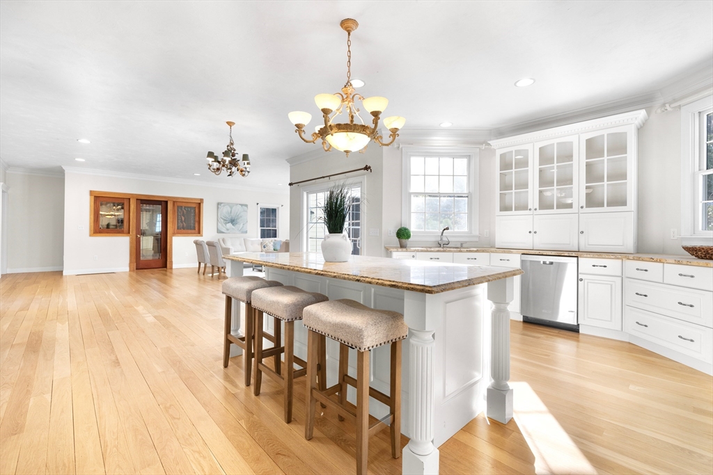 52 Chandler Circle Andover, MA 01810 - Photo 6 of 25 a large kitchen with kitchen island a chandelier
