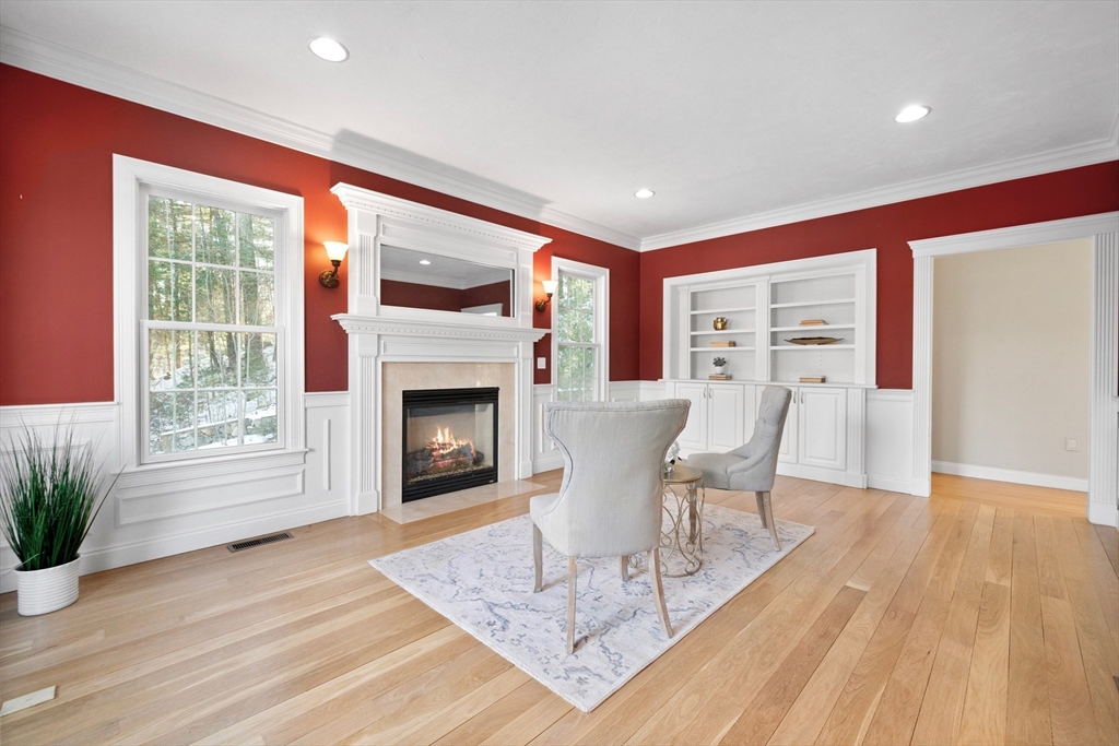52 Chandler Circle Andover, MA 01810 - Photo 9 of 25 a living room with furniture a window and a fireplace