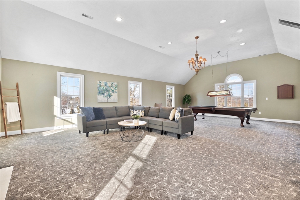 52 Chandler Circle Andover, MA 01810 - Photo 10 of 25 a living room with furniture and a table