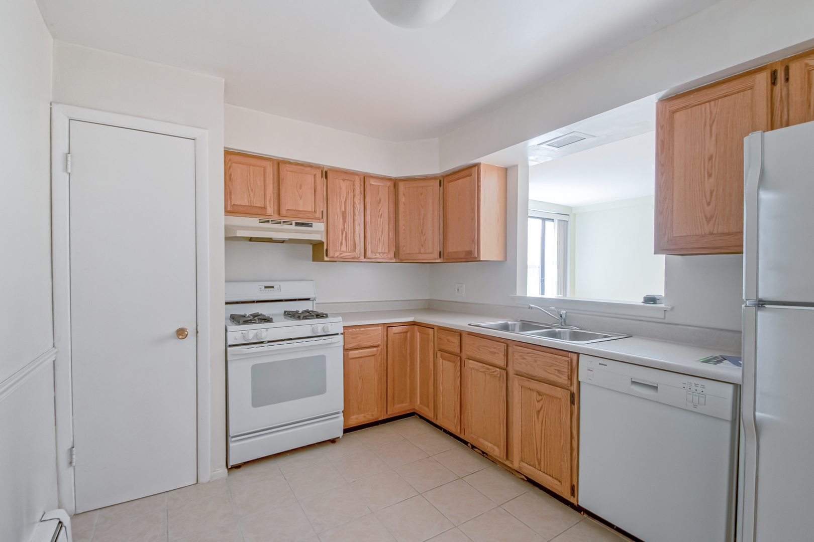 2336 North Commonwealth Avenue, Unit 107 Chicago, IL 60614 - Photo 6 of 12 a kitchen with a sink stove and cabinets