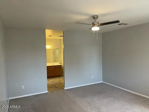 an empty room with a empty space and a ceiling fan