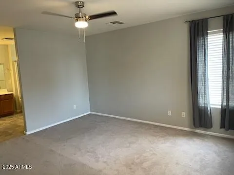 an empty room with windows and entrance