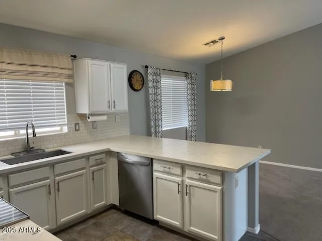 a kitchen with a sink and cabinets