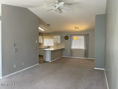 a view of a kitchen with a sink cabinets and a window