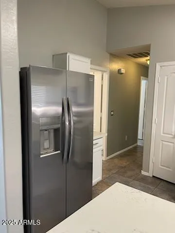 a bathroom with a shower and a glass door