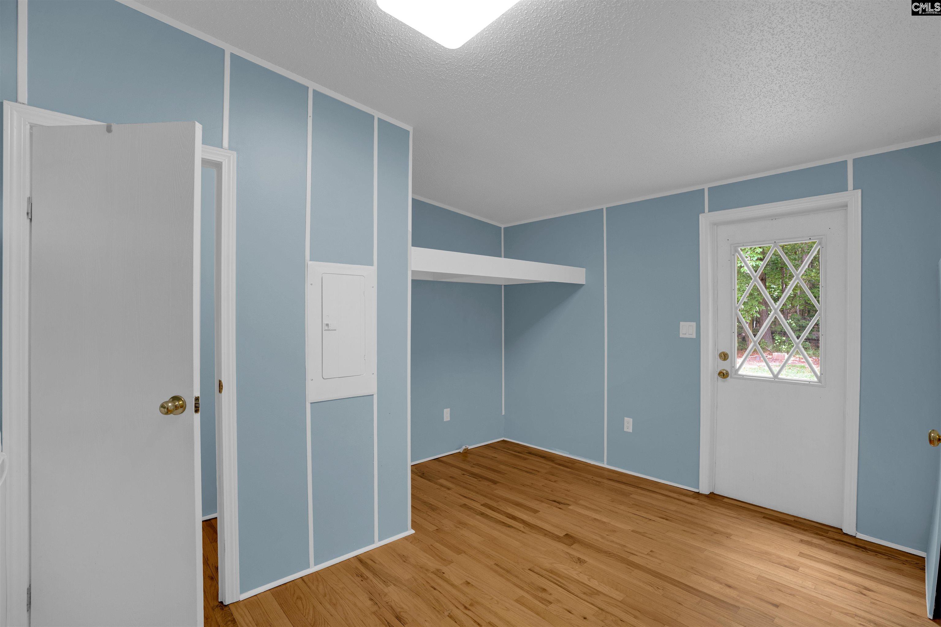 304 Cooper Road Blythewood, SC 29016 - Photo 20 of 29 a view of empty room with window and wooden floor