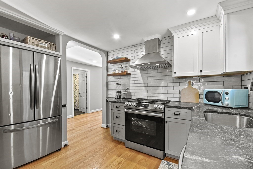132 Pepperell Road Groton, MA 01450 - Photo 13 of 31 a kitchen with a stove top oven and refrigerator