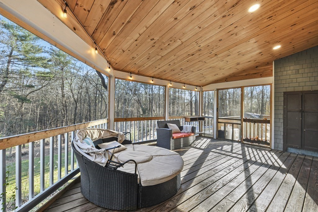 132 Pepperell Road Groton, MA 01450 - Photo 26 of 31 a balcony with furniture and wooden floor
