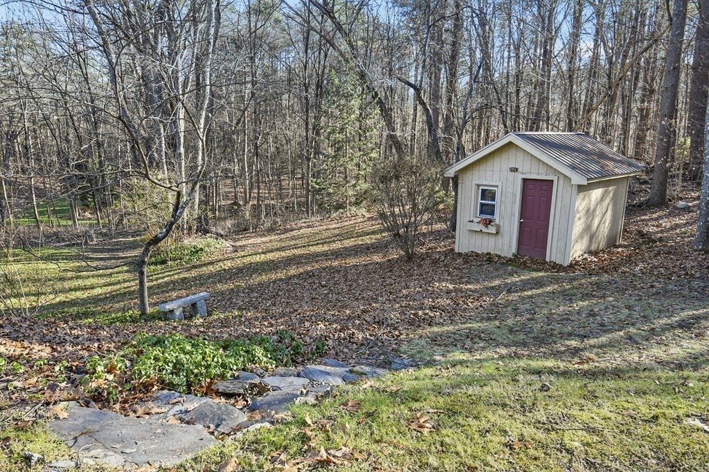 132 Pepperell Road Groton, MA 01450 - Photo 29 of 31 a small barn in the middle of a field