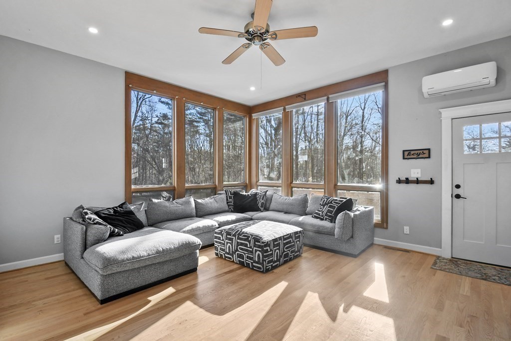 132 Pepperell Road Groton, MA 01450 - Photo 5 of 31 a living room with furniture and a large window