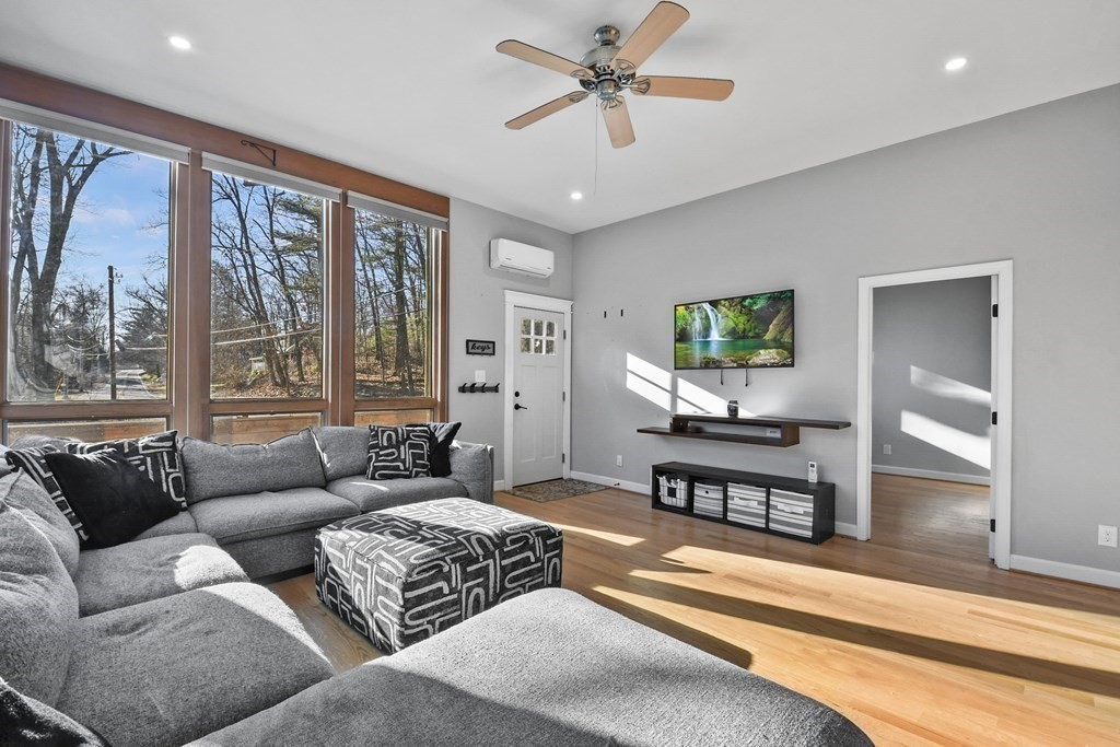 132 Pepperell Road Groton, MA 01450 - Photo 6 of 31 a living room with furniture and a large window