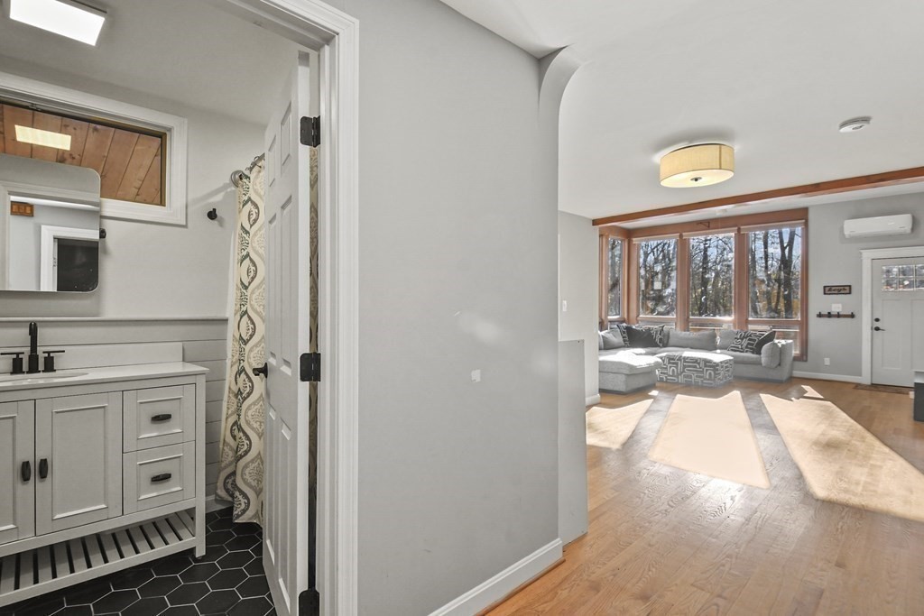 132 Pepperell Road Groton, MA 01450 - Photo 10 of 31 a view of a hallway with washer and dryer