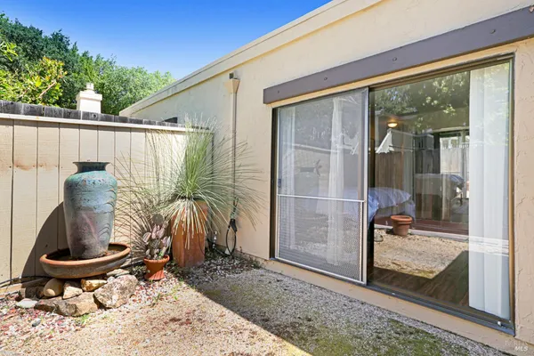 a front view of a house with porch and outdoor seating